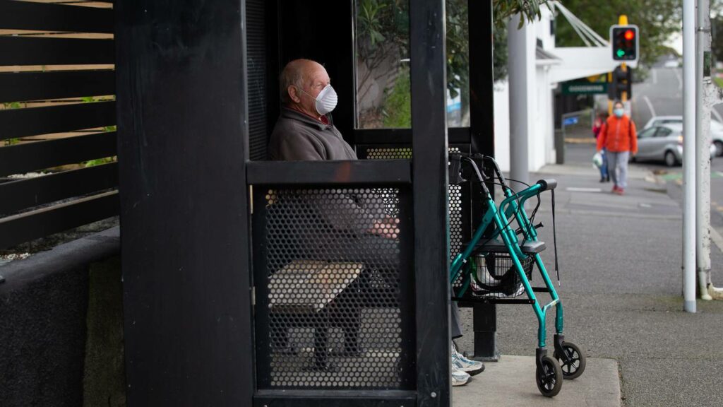 Old man sit in a bus station